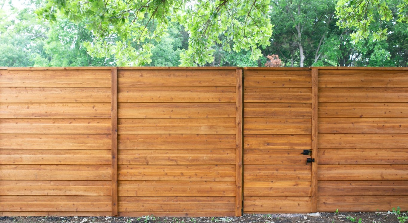 Durable wood fence with gate installed in Carson, CA
